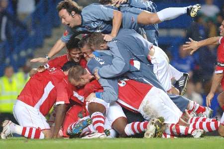 Charlton celebrate after Bryan Hughes converted the winning penalty. Picture: MATTHEW WALKER