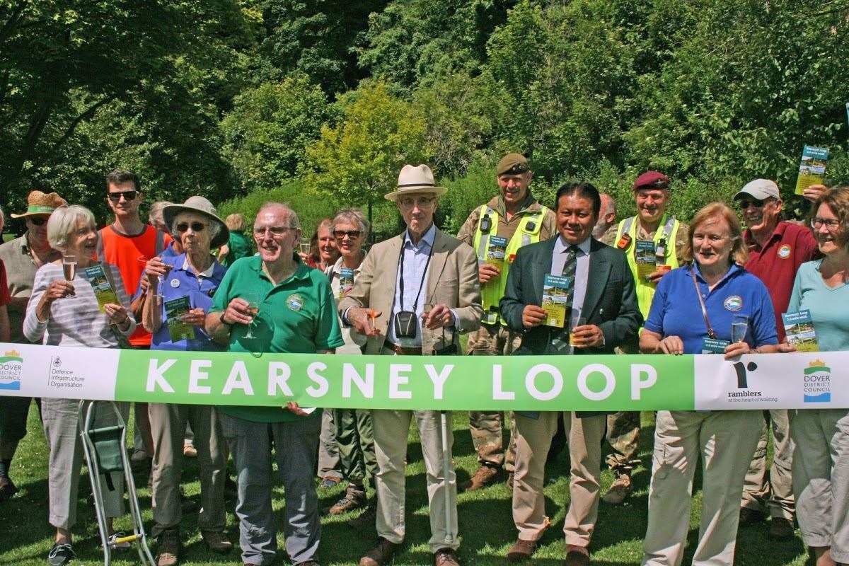 Alan Ford cuts the ribbon to declare the Kearsney Loop open. Next to him is MajBhupjit Rai from the MoD, and White Cliffs Ramblers chairman Margaret Lubbock
