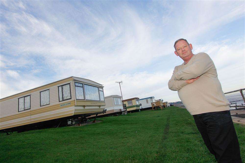 John Sissons in front of the caravans at Nutts Farm featured in the E4 advert