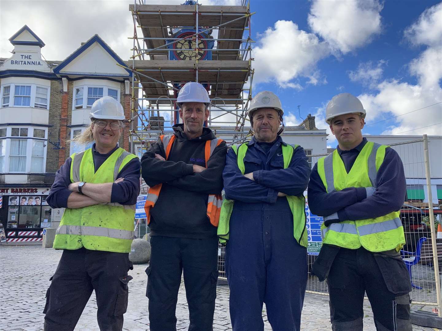 Clock expert Kevin Allen, third from left, and his team about to tackle the clock tower in Sheerness town centre. They say it will take three days to pull down so it can be taken to Derby for a full restoration