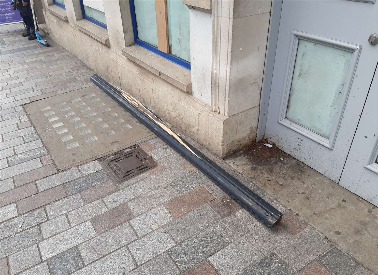 A length of timber which fell from a building in Maidstone High Street, narrowly missing people waiting at a bus stop