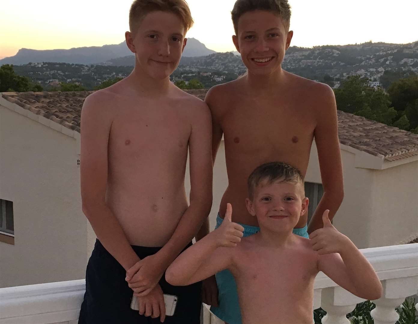 Jayden pictured with brothers Callum and Liam