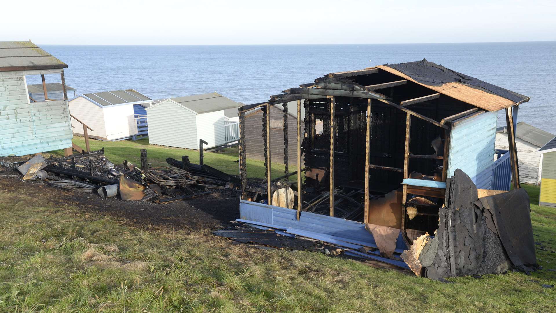 One of the burnt out beach huts on Tankerton slopes