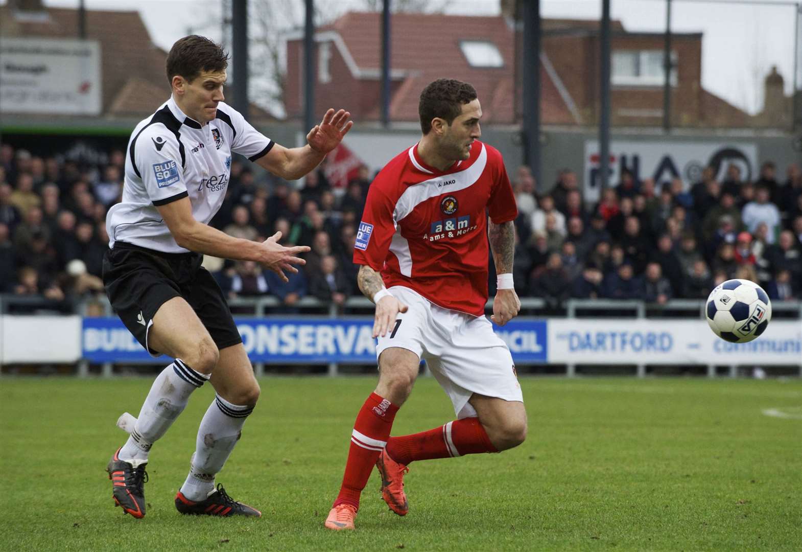 Princes Park derby action from 2012 as Tom Bonner is up against Liam Enver-Marum of Ebbsfleet. Picture: Andy Payton