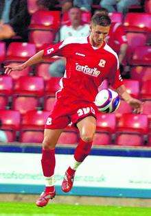 Swindon full-back Callum Kennedy has joined Gillingham on a one-month loan