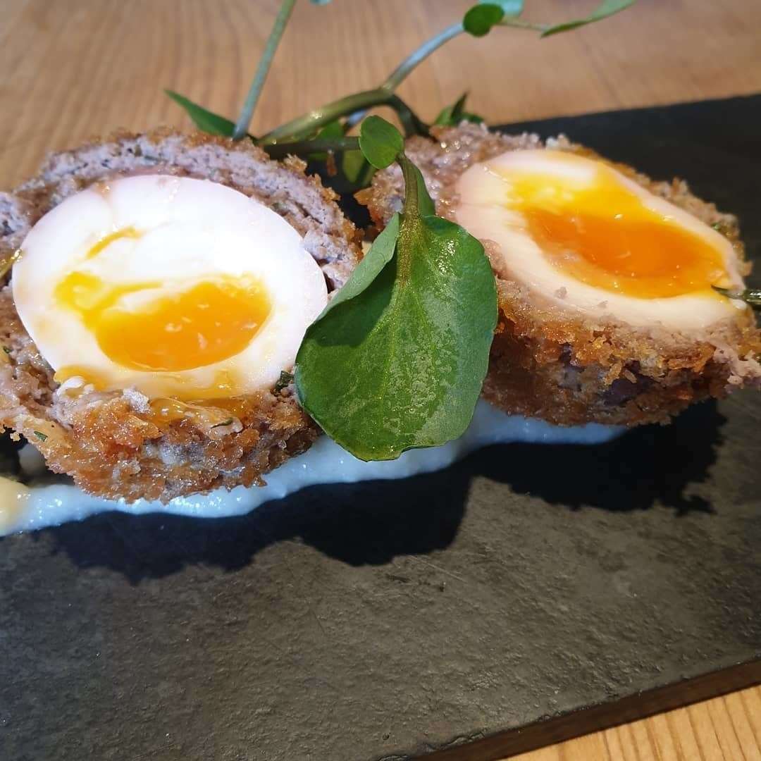 One of the items on the menu is a wild boar and thyme scotch egg with a spiced apple puree