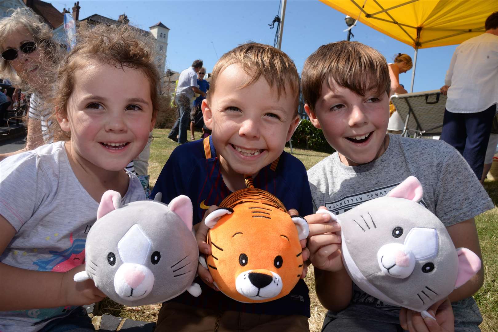 Payton, three, Micah, seven and Eben Barfoot, nine, aquired some soft toys from one of the stalls