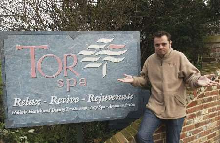 SWITCHED OFF: Ky Wilkinson had to take down decorations on his business sign after a solicitor's letter. Picture: PAUL DENNIS