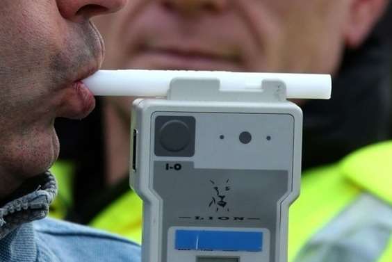 Police using the new drug testing equipment (posed by a model). Google Images.