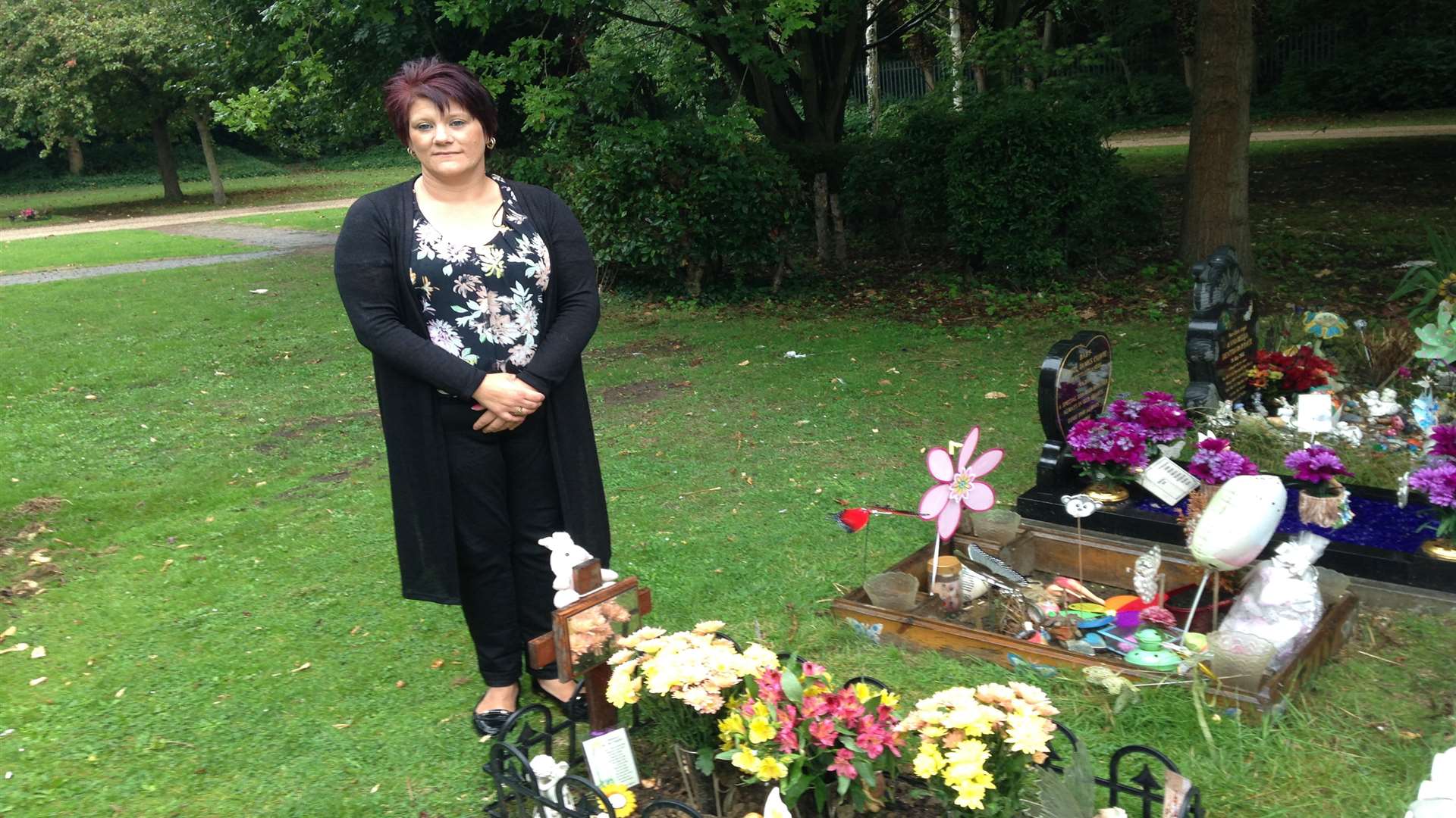 Anna-Marie Jones at the grave of her daughter Billie-Marie, which has been vandalised five times