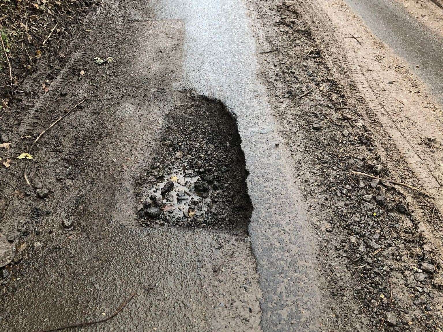 One of the huge craters down a narrow lane in the village