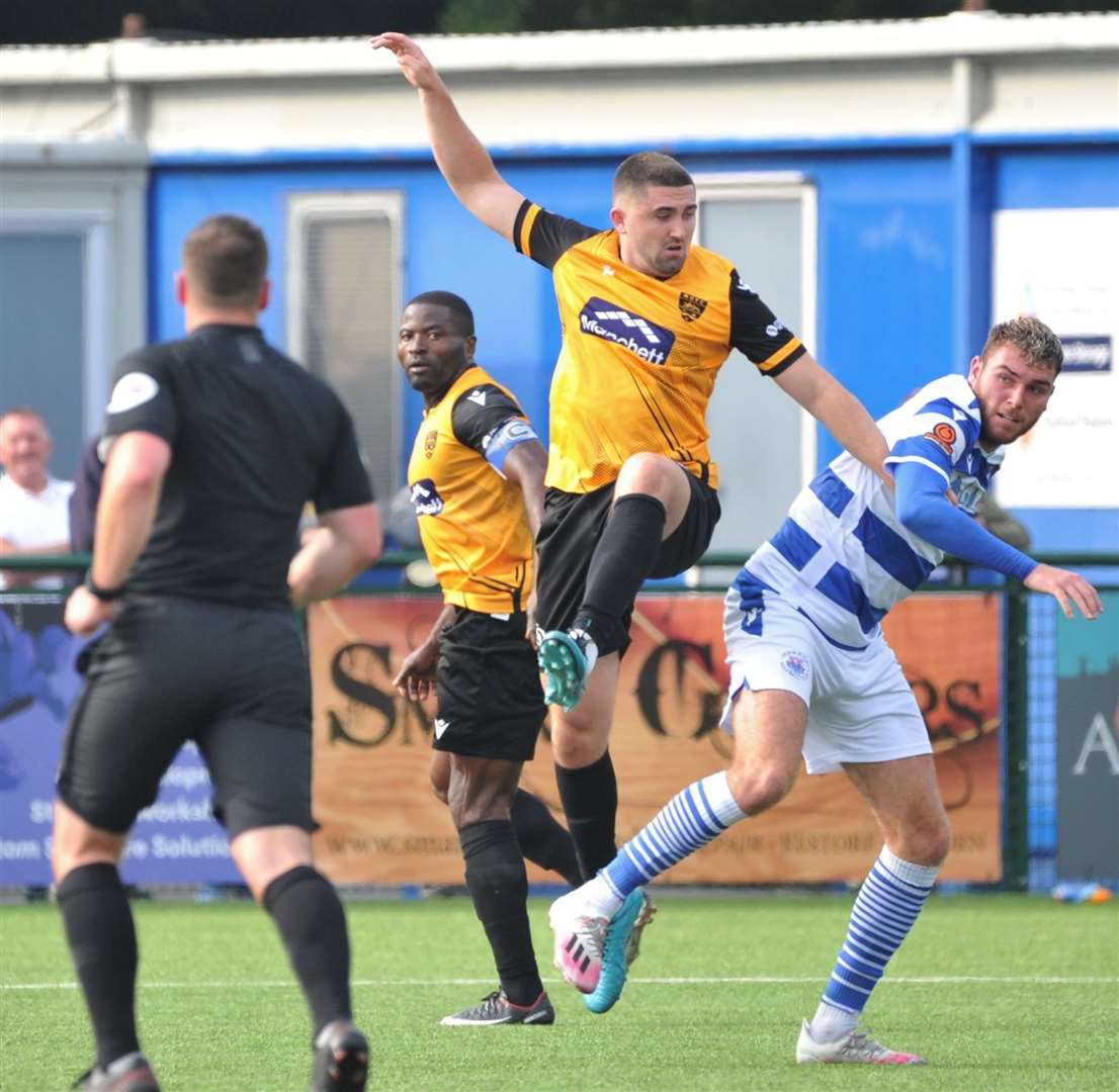 Maidstone defender Taylor Curran gets stuck in at Oxford City Picture: Steve Terrell