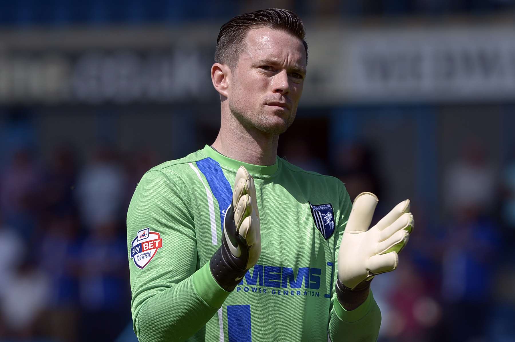 Stuart Nelson thanks the fans for their support at full-time on Sunday Picture: Barry Goodwin