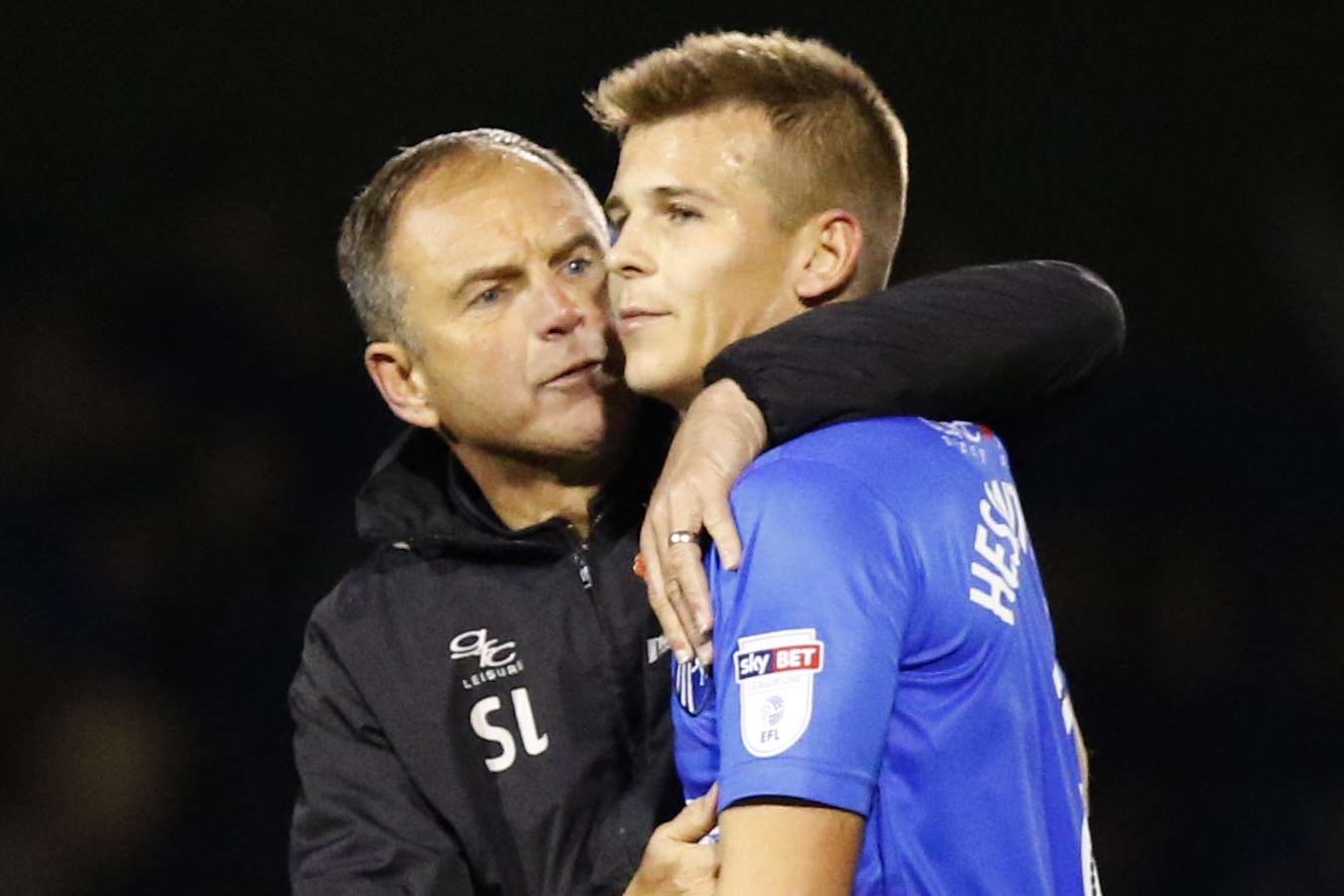 Gills caretaker manager Steve Lovell celebrates their point against Bury with Jake Hessenthaler Picture: Andy Jones