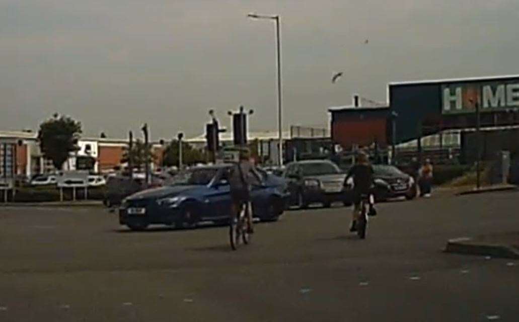 Dashcam footage shows two children riding into oncoming traffic on their bikes. Picture: Facebook