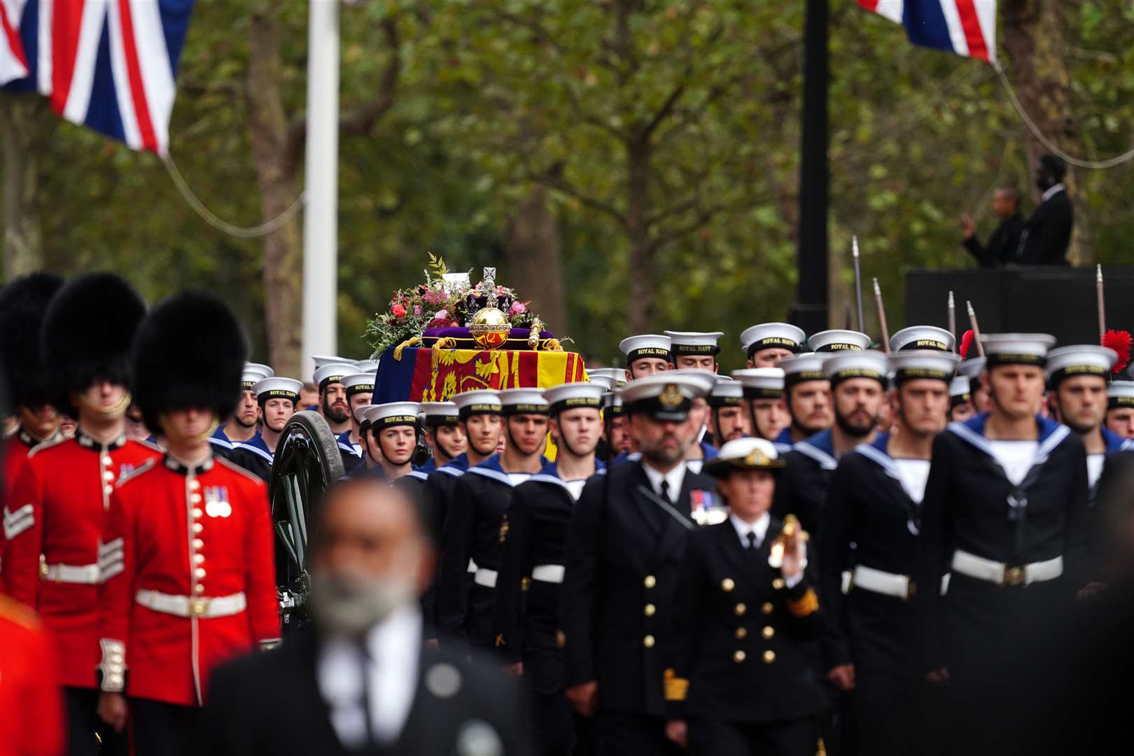 The State Gun Carriage carries the coffin of Queen Elizabeth II, draped in the Royal Standard with the Imperial State Crown and the Sovereign's orb and sceptre, in the Ceremonial Procession down The Mall, following her State Funeral at Westminster Abbey, London. Picture: PA