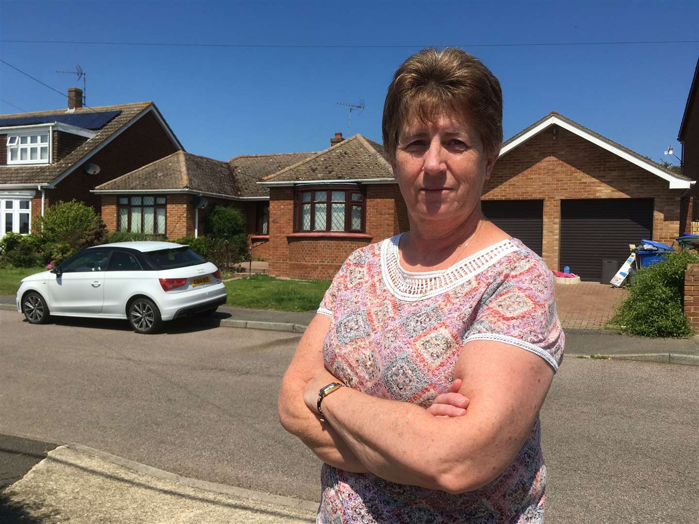 Neighbour Julie Clarke in front of the bungalow in Nelson Avenue, Minster, which developers want to demolish