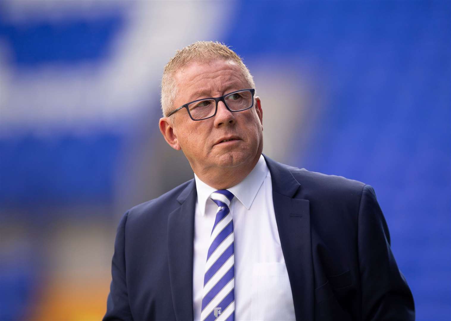 Gillingham chairman Paul Scally reacts to protests over his running of the club