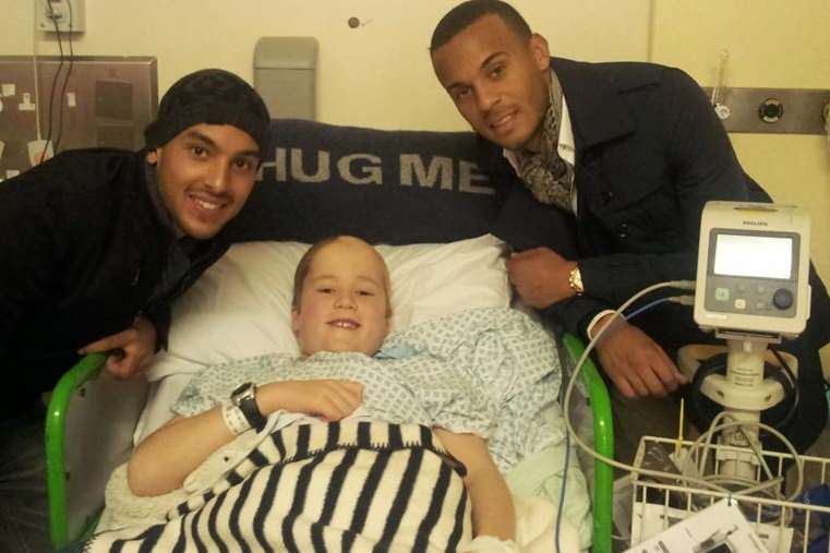 Silas Pullen with footballers Theo Walcott and Ryan Bertrand