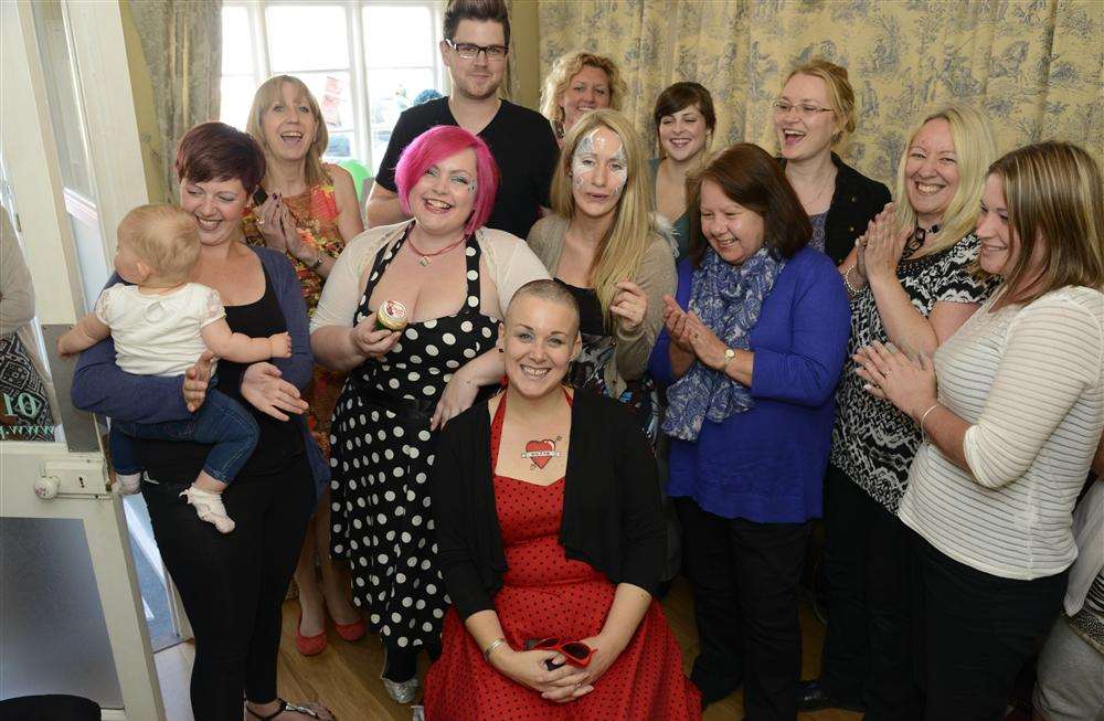 Ali Hollands has her head shaved during the World's Biggest Coffee morning for McMillan