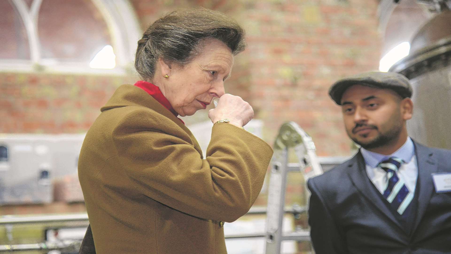 Princess Anne sampling the whiskey during her grand tour. Credit: Gary Browne