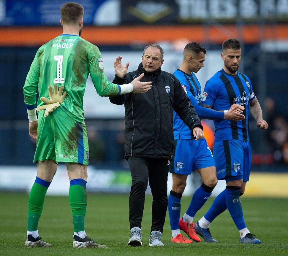 Gillingham boss Steve Lovell congratulates keeper Tomas Holy at the final whistle Picture: Ady Kerry (7823969)