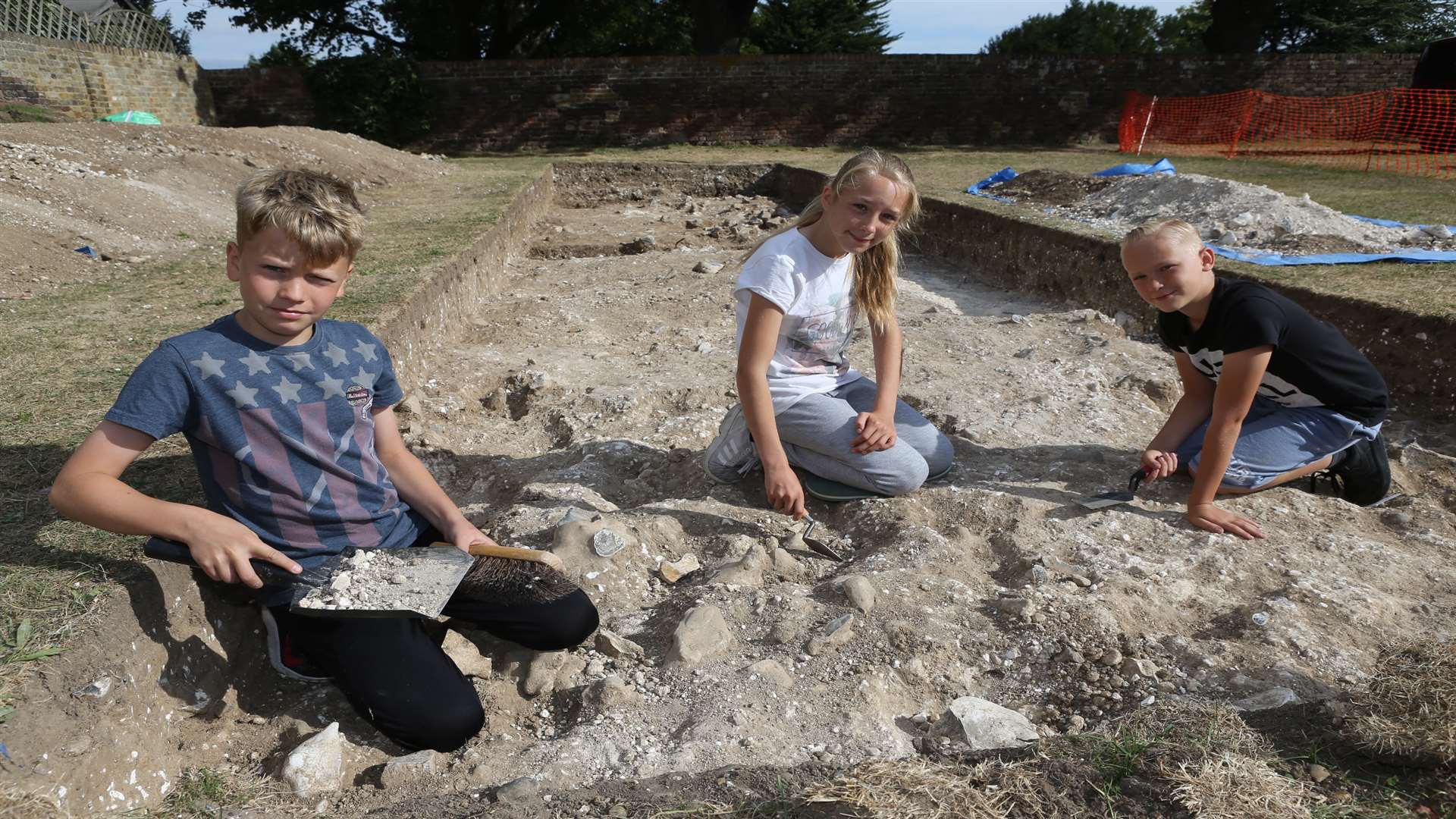 Tom Dynes, 11, Daisy Canham, 12 and her brother, Daniel, 10, all young archaeologists