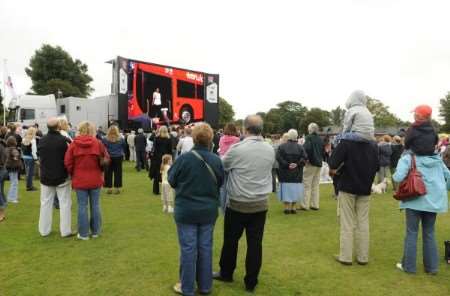 People in Memorial Park, Herne Bay, watch the Olympic handover ceremony live from Beijing on a giant screen