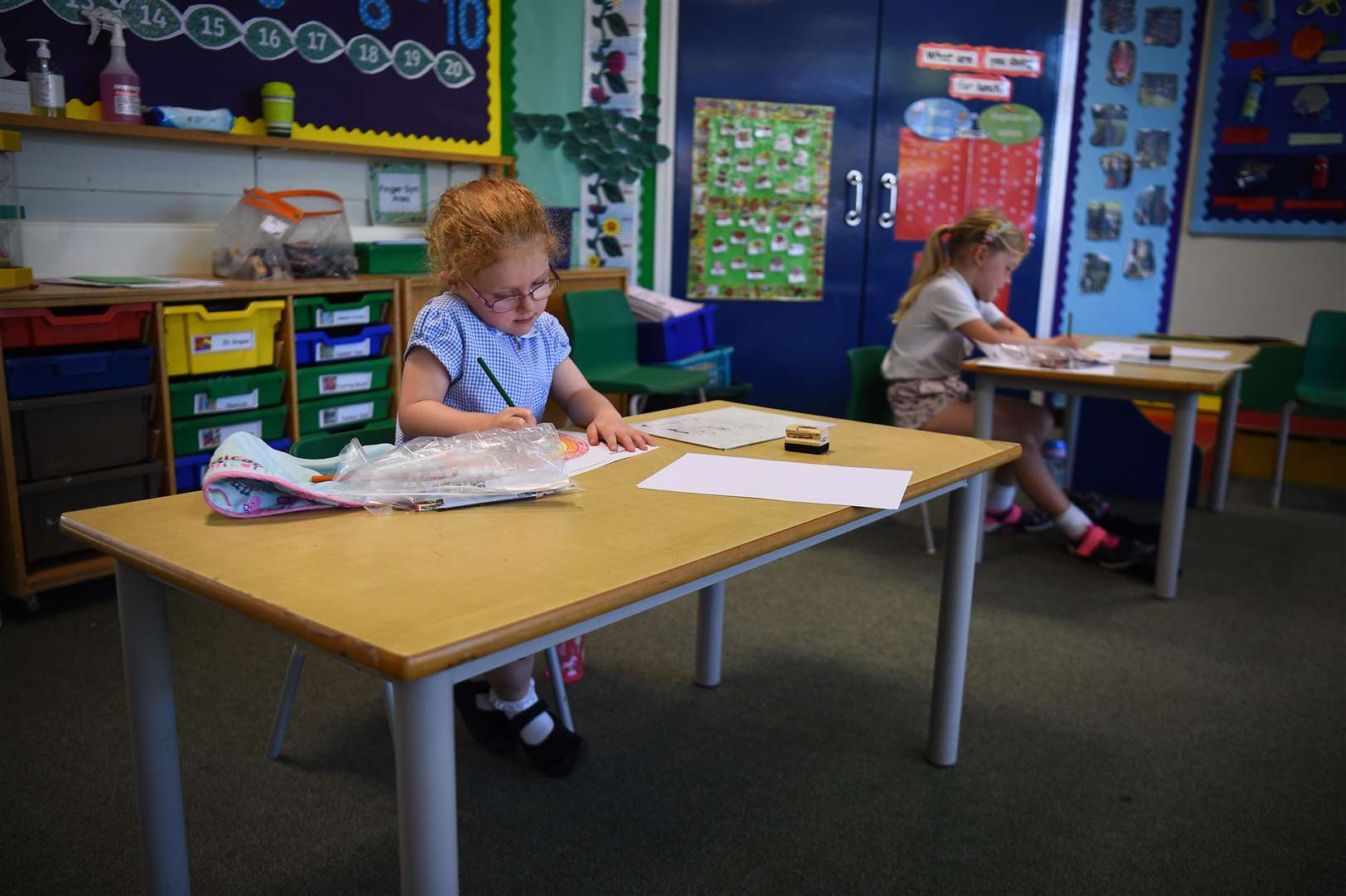 Pupils sit at separate desks at Hiltingbury Infant School in Hampshire (Kirsty O’Connor/PA)