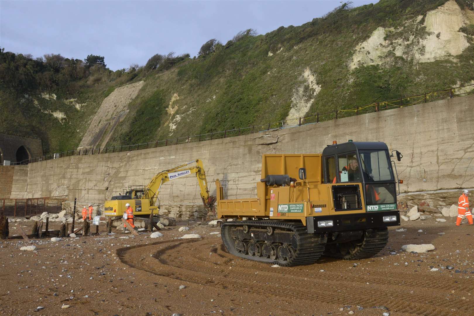 Repair work is underway on the damaged sea wall and railway embankment near Shakespeare Cliff tunnel between Dover and Folkestone.