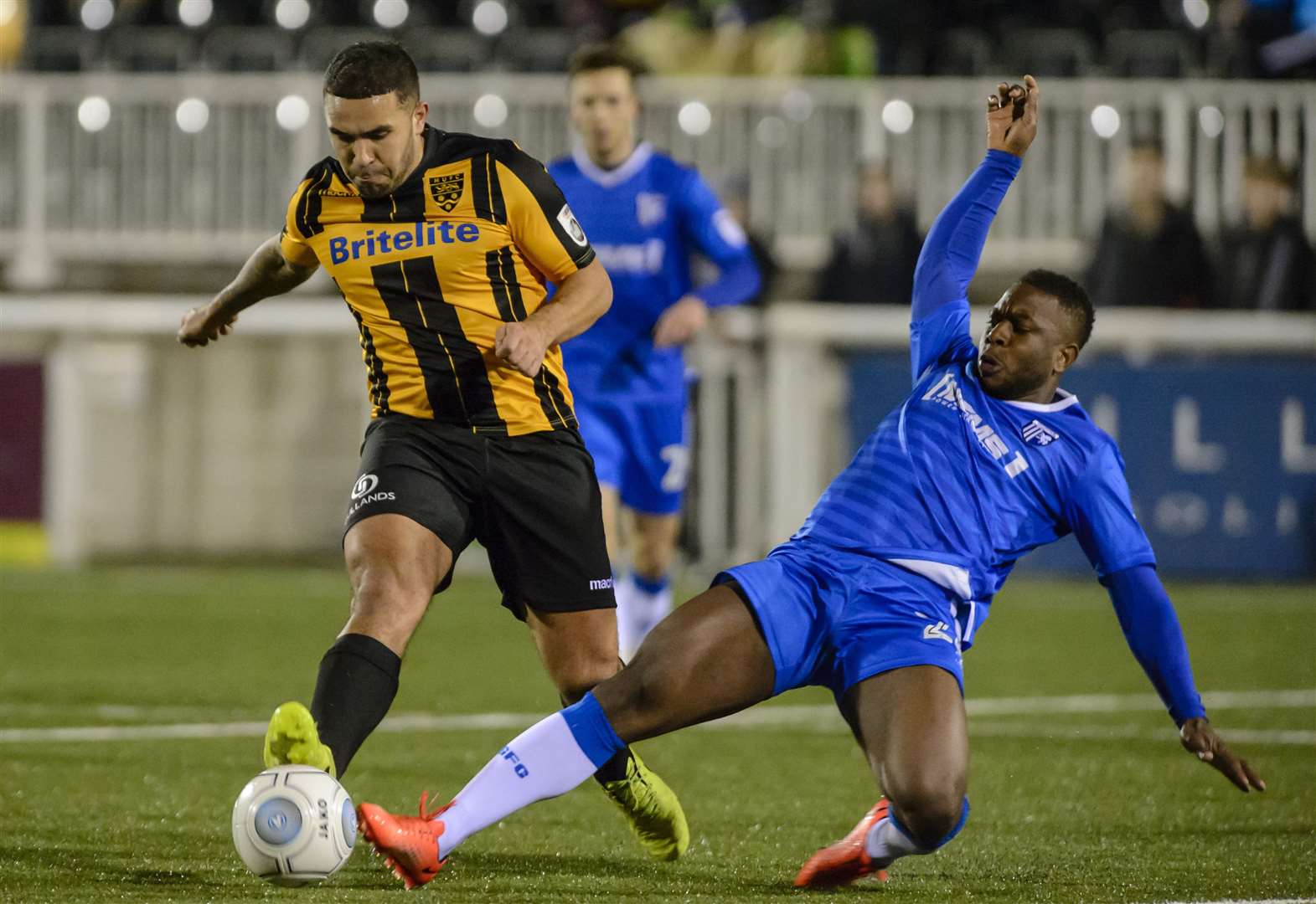 Action from last season's Kent Senior Cup quarter-final as Maidstone's Jai Reason does battle with Frank Moussa of Gillingham Picture: Andy Payton