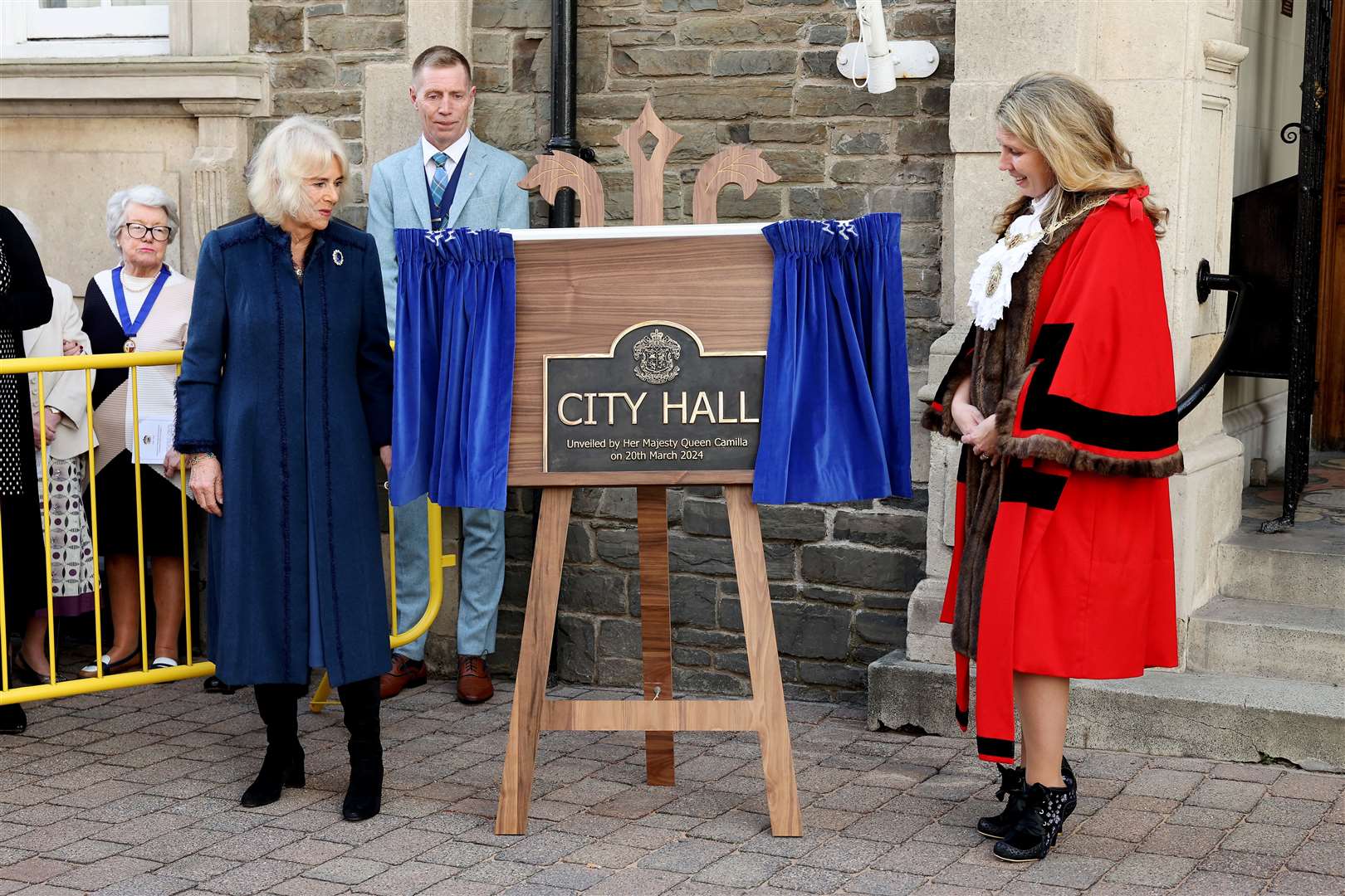 Queen Camilla unveils a commemorative plaque outside of Douglas Borough Council after conferring city status on the Borough of Douglas (Chris Jackson/PA)