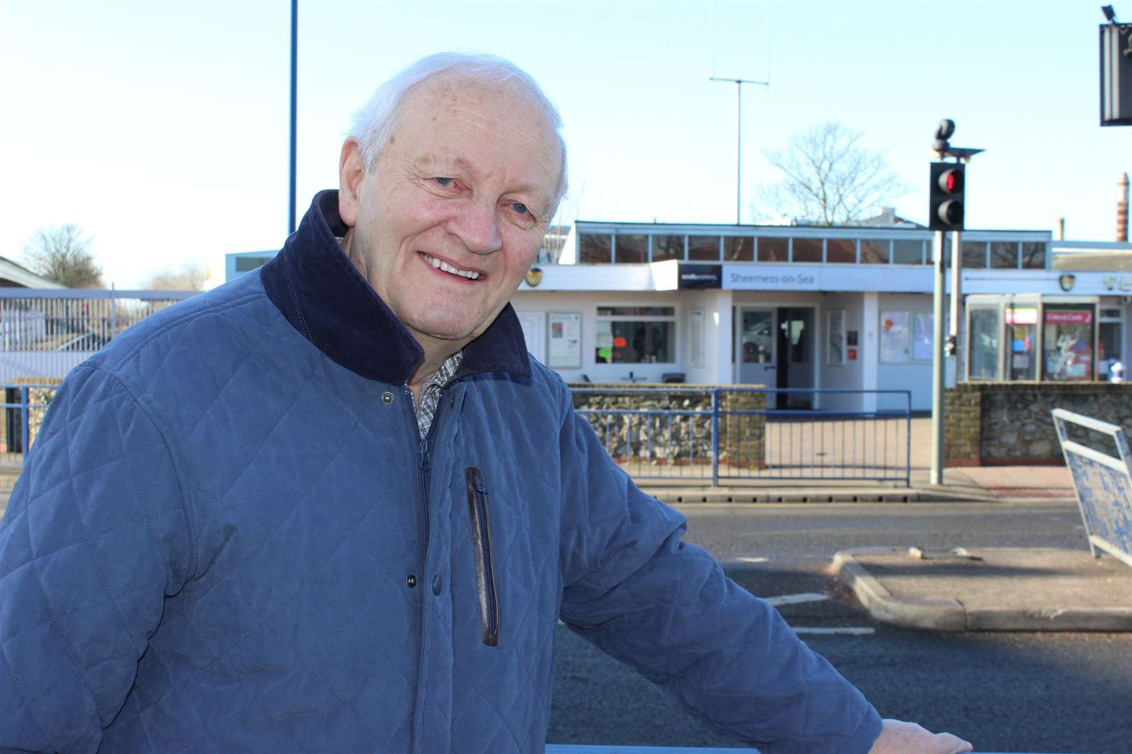 Taxi driver Terry Baker, pictured outside Sheerness railway station, was trapped in his cab when a train crashed through the station wall in February 1971