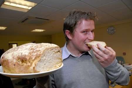 Reporter Adam Williams gets his teeth into the £15 loaf. Picture: Barry Duffield