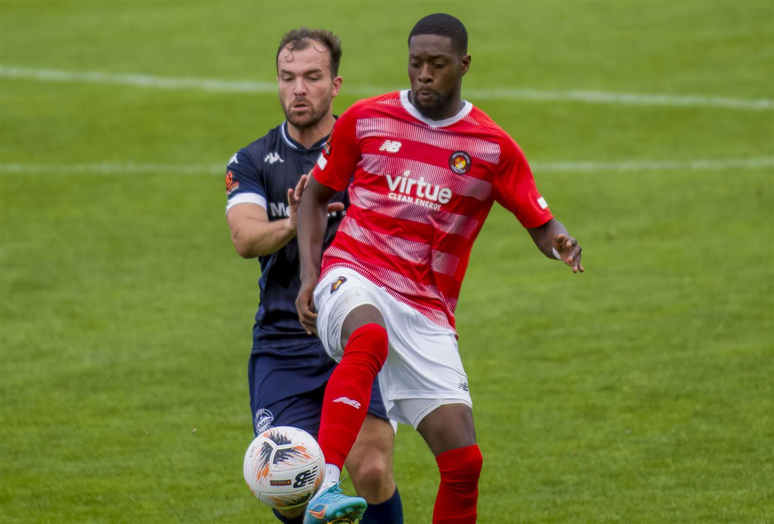 Dover player-assistant Mitch Brundle up against Ebbsfleet forward Rakish Bingham earlier in the season. The teams will meet this weekend at Crabble. Picture: Ed Miller/EUFC