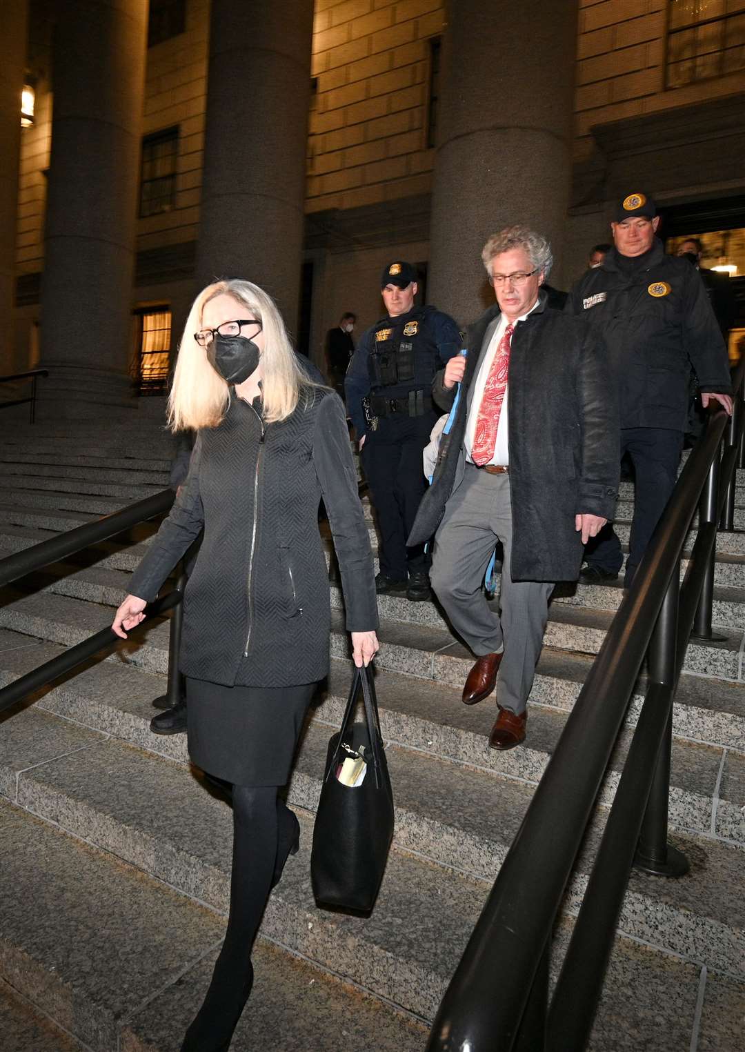 Defence lawyers Laura Menninger (left) and Jeffrey Pagliuca (middle right) leaving the federal courthouse after Maxwell was convicted (Anthony Behar/PA)