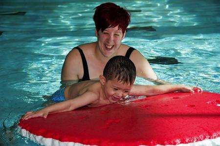 Oliver with mum Natalie, happy in the pool
