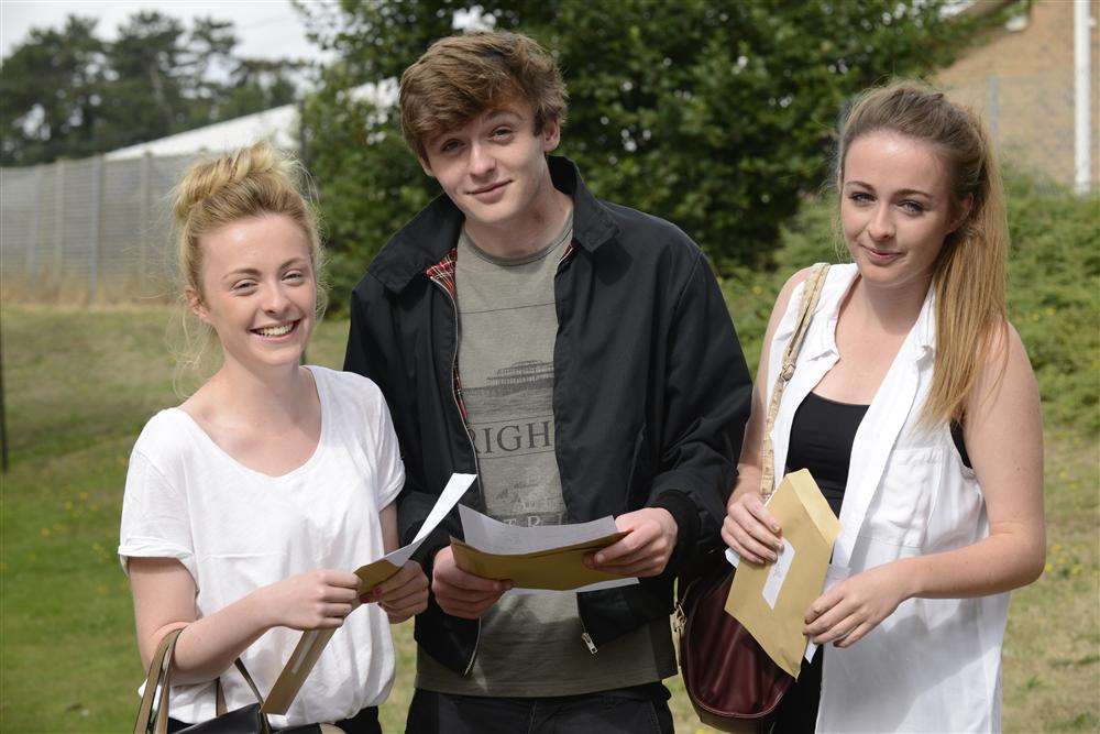 Triplets Orla, Jack and Eliza McCabe, open their results at St Simon Stock in Maidstone