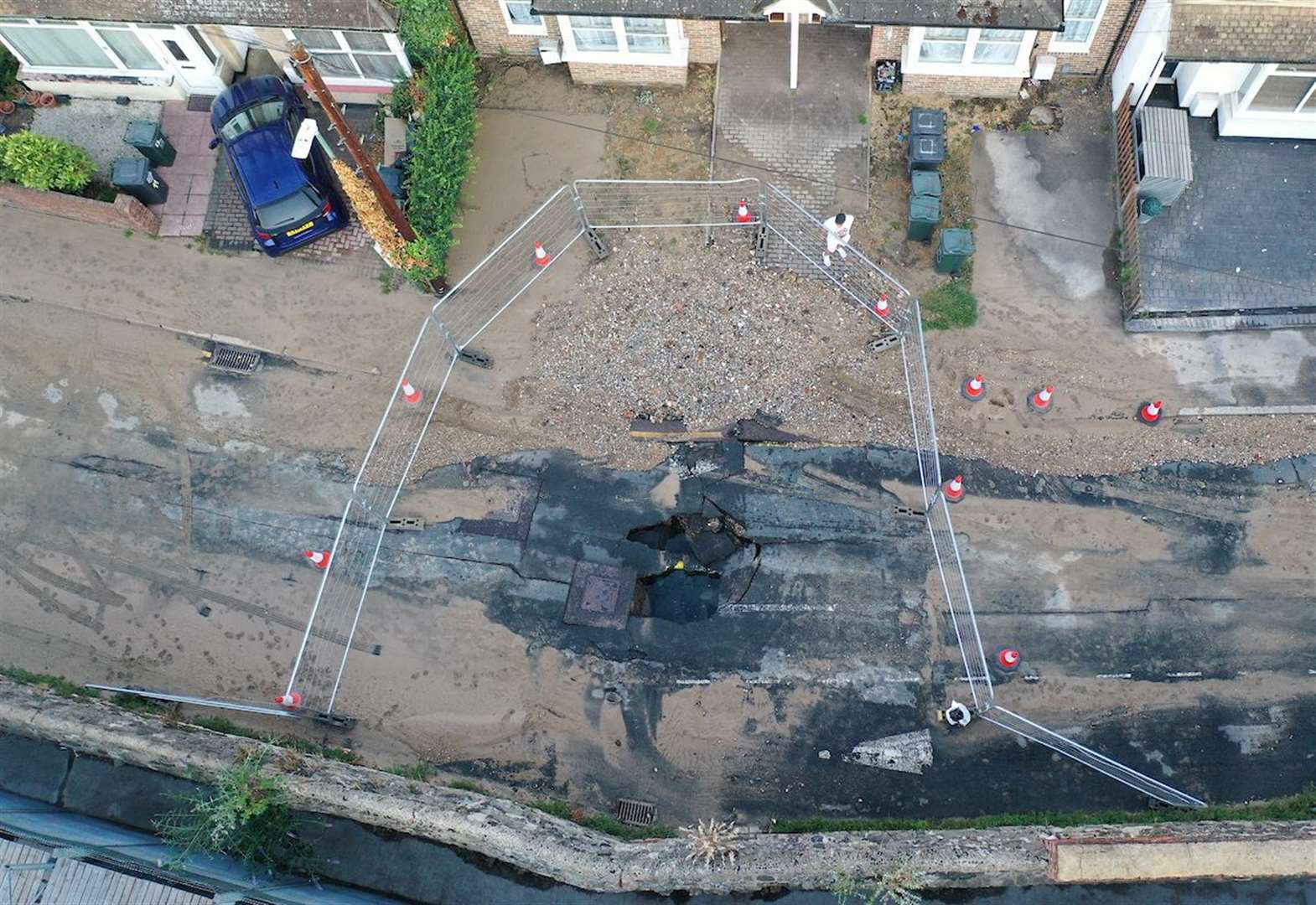 Sinkhole opens in street after water main bursts