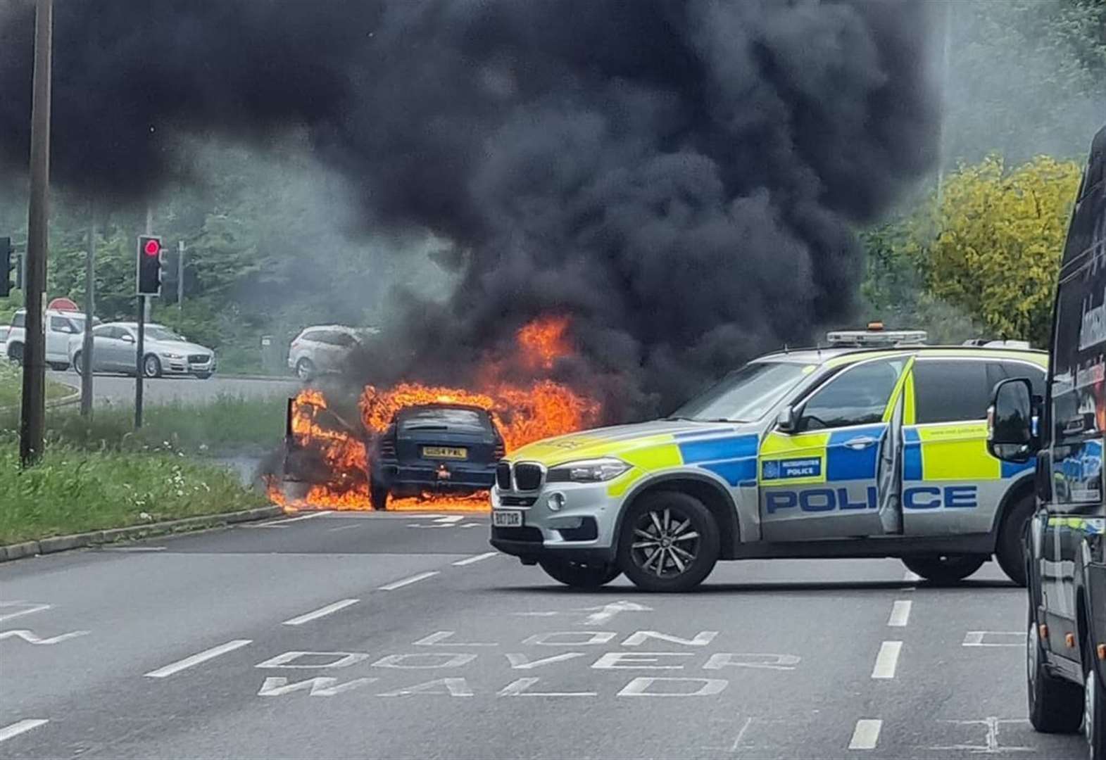 Moment car inferno holds up commuters