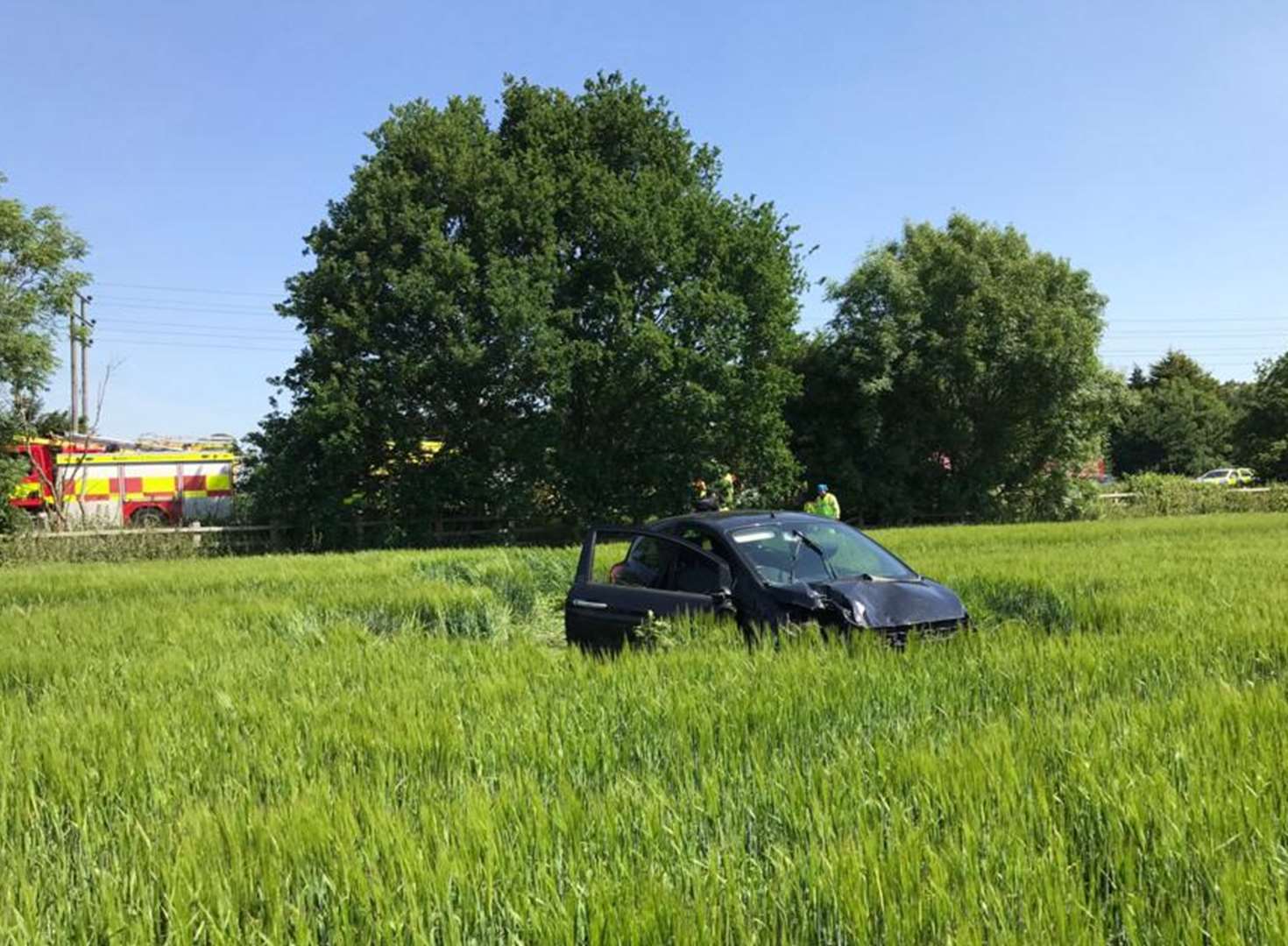 Car lands in field after crash on M2