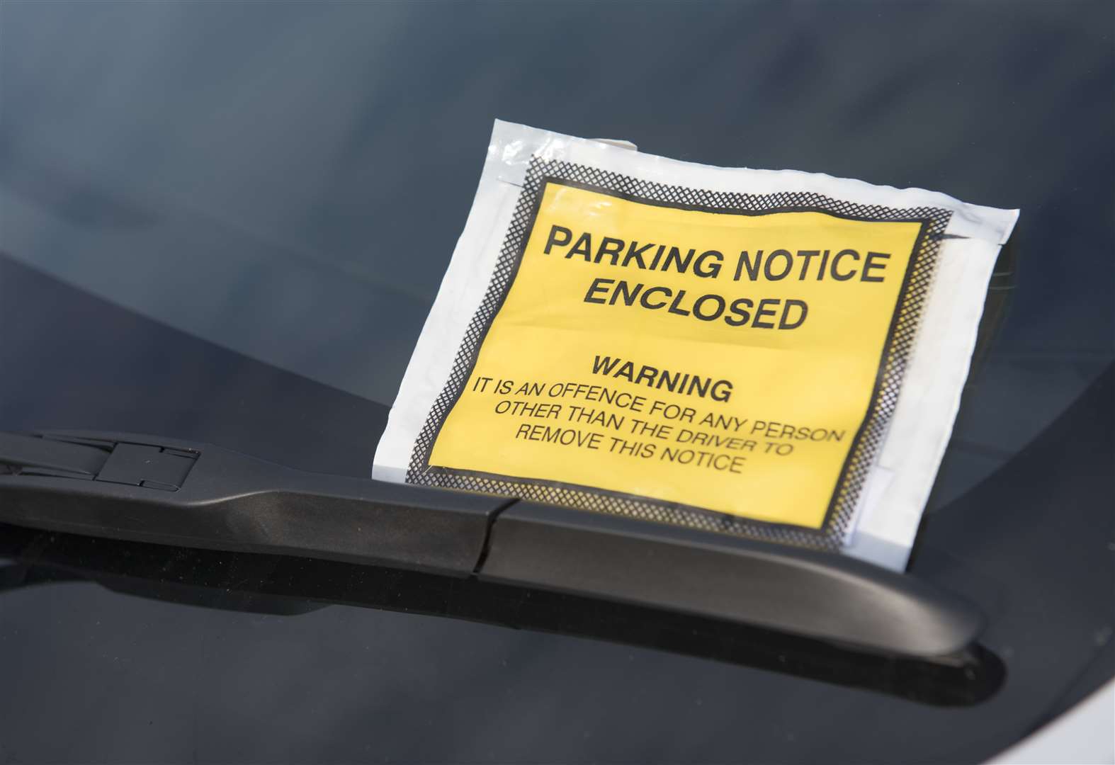 Plans to cap private parking fines on hold
