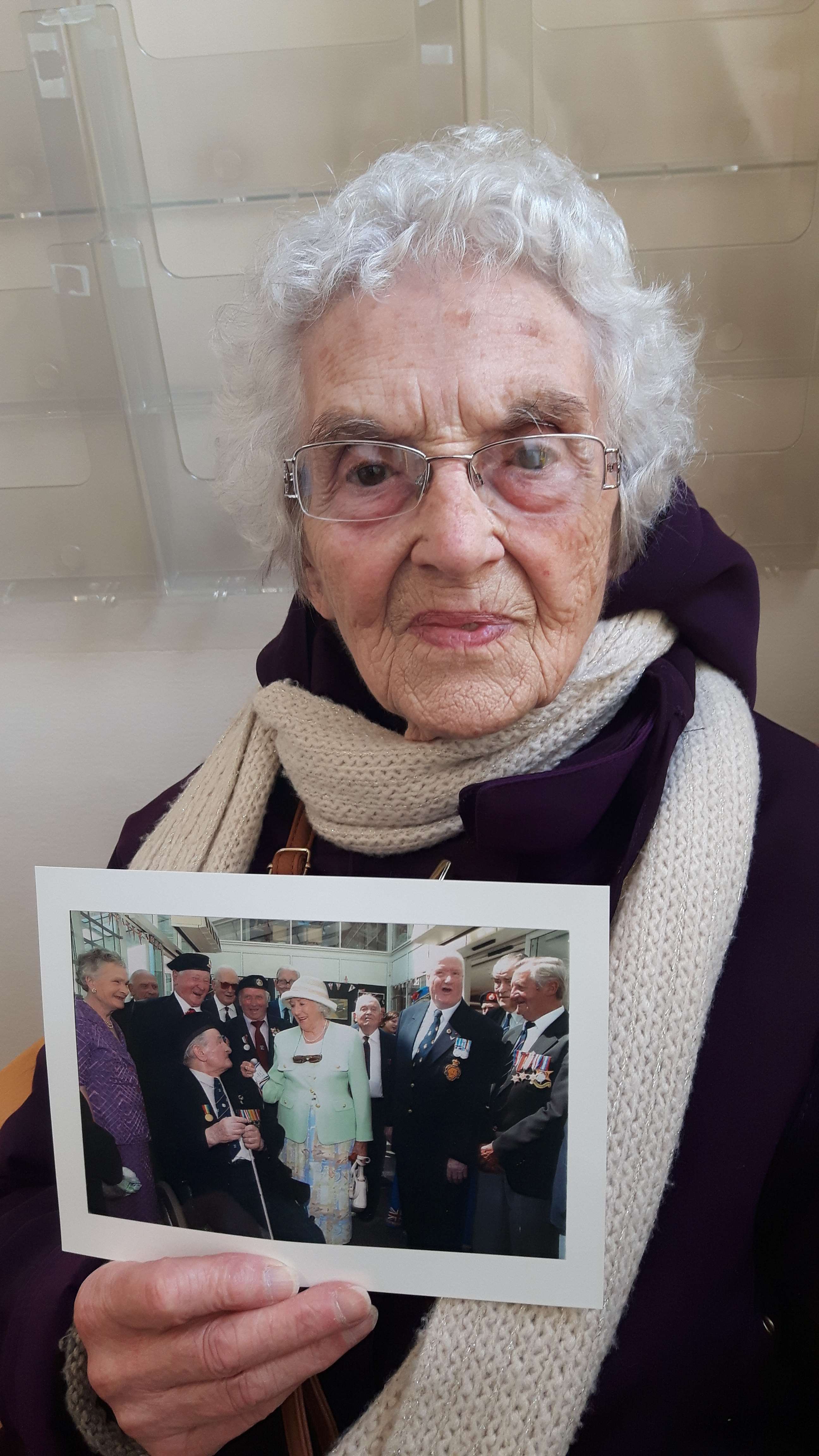 Grace Wray, 94, from Eastry, with a picture of her late husband Bill with Dame Vera Lynn