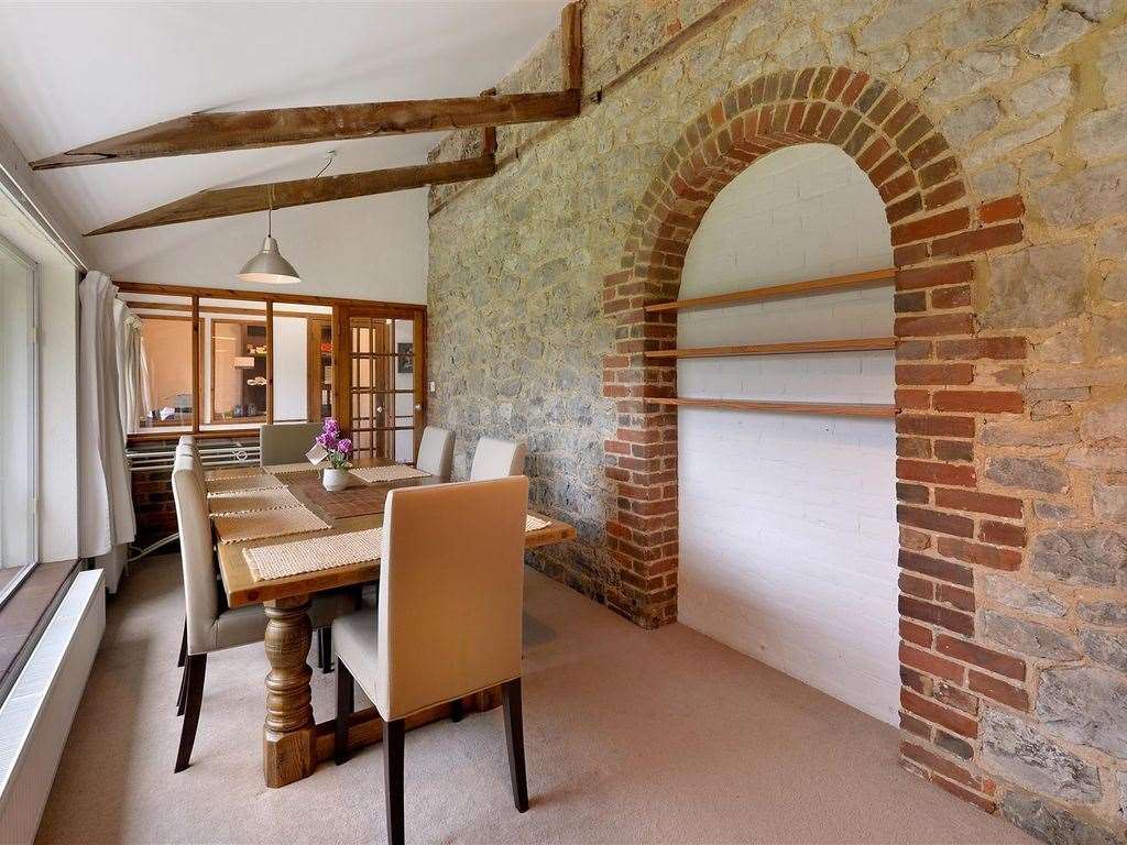 Exposed beams and brickwork maintain the historical feel of this former oast house. Photo: Zoopla