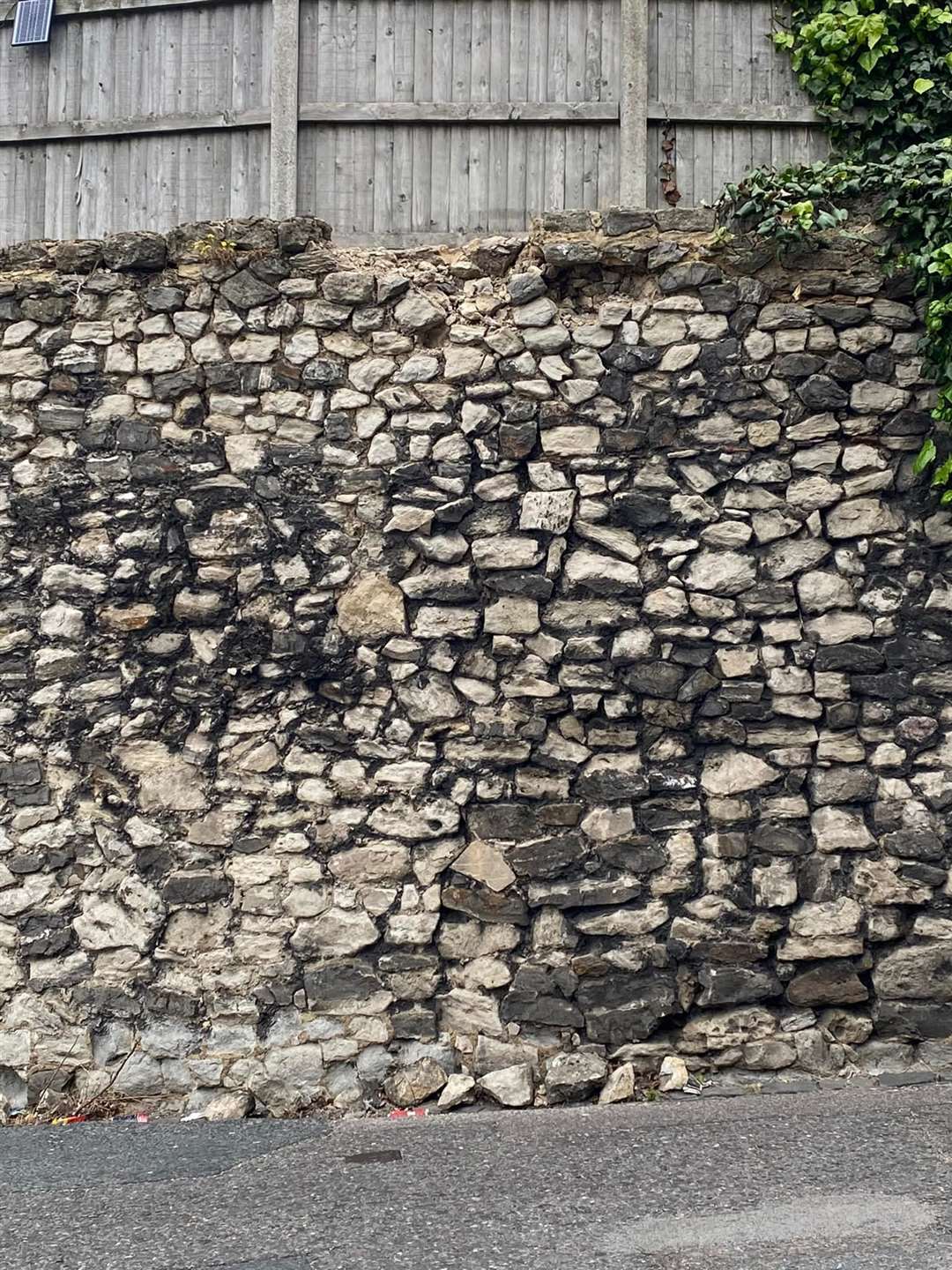 Stones have fallen from the top of the bowing wall in The Cut, Rochester. Images from Teresa Brighouse