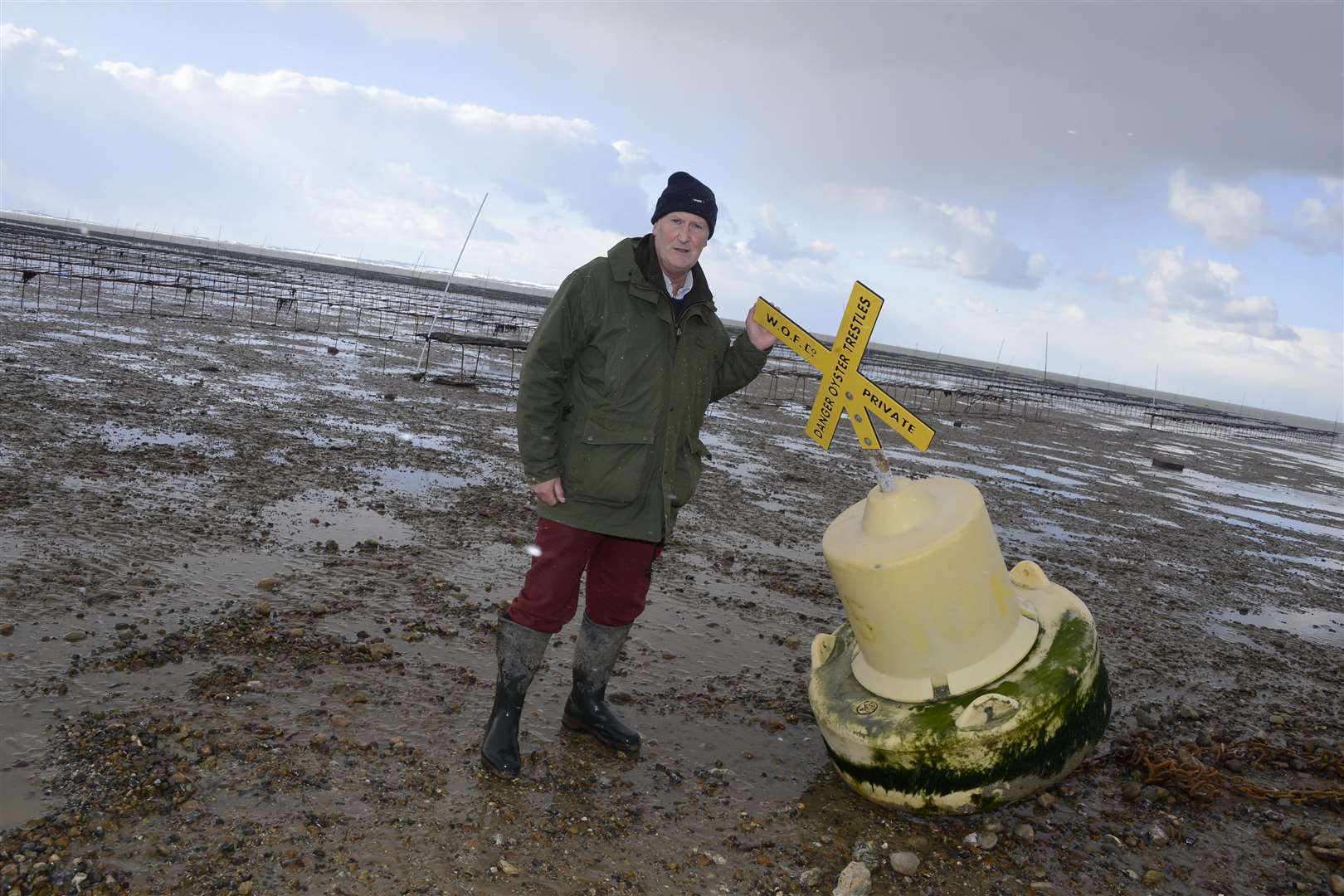 Ashley Clark pictured with the oyster racks. Picture: Paul Amos. (1598220)