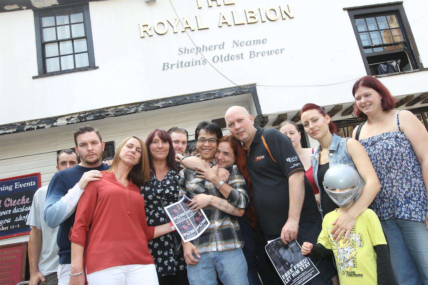 Fred Buenavista, who faces deportation, is reunited with friends, whilst on bail, outside The Royal Albion Pub in Maidstone, where he used to work