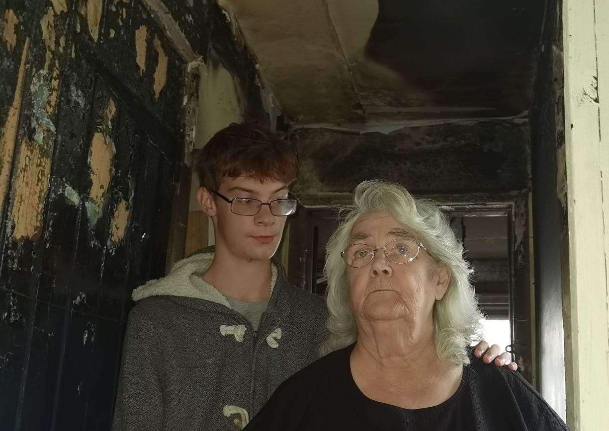 Sue McFarlane, pictured with grandson Marcus, are struggling to cope and have criticised the way the repairs process is being handled by Gravesham council. Picture: Trish McFarlane