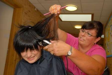 Claire Walker cuts Hadley's hair
