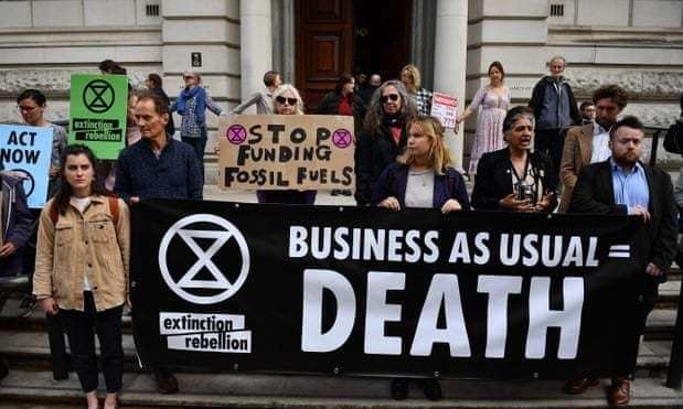 Extinction Rebellion activist Julie Mecoli, from Canterbury, protesting outside Treasury Building on April 25